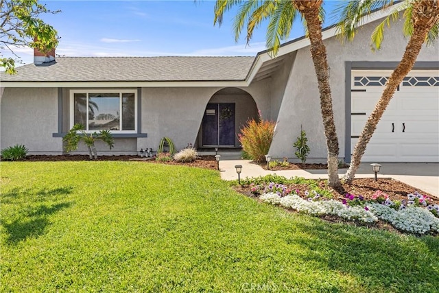 ranch-style home featuring roof with shingles, a garage, a front yard, and stucco siding