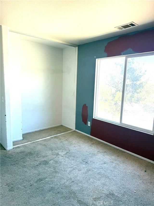 28764 Avalon Ave, Moreno Valley, CA 92555 - empty room featuring carpet floors and baseboards