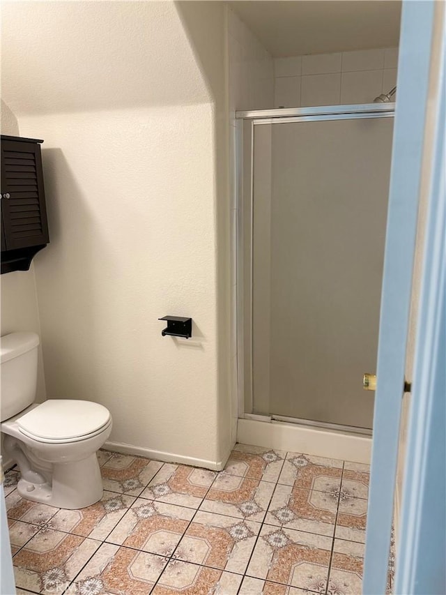 28764 Avalon Ave, Moreno Valley, CA 92555 - full bath featuring a stall shower, toilet, and baseboards