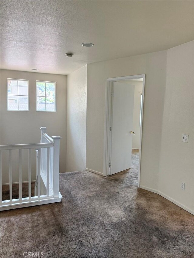 28764 Avalon Ave, Moreno Valley, CA 92555 - carpeted spare room with a textured ceiling and baseboards