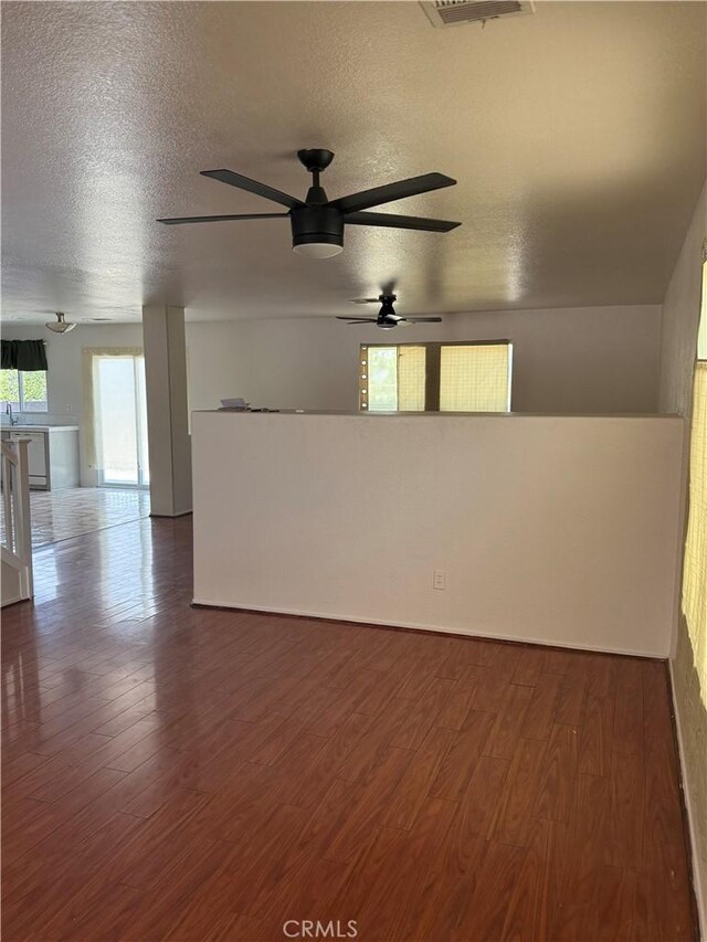 28764 Avalon Ave, Moreno Valley, CA 92555 - spare room featuring ceiling fan, dark wood-style floors, and a textured ceiling