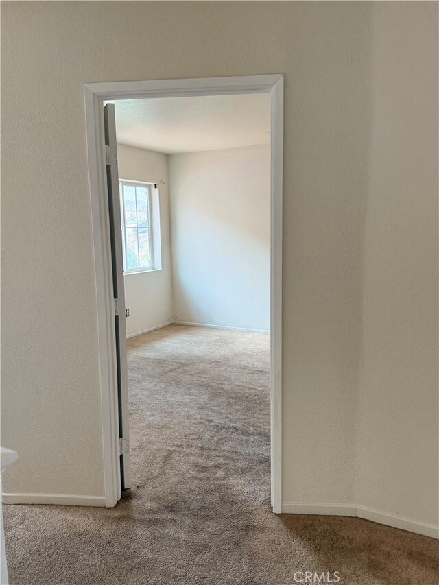 28764 Avalon Ave, Moreno Valley, CA 92555 - carpeted empty room with baseboards