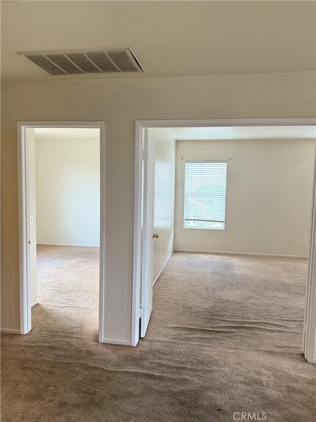 28764 Avalon Ave, Moreno Valley, CA 92555 - corridor with carpet floors and baseboards