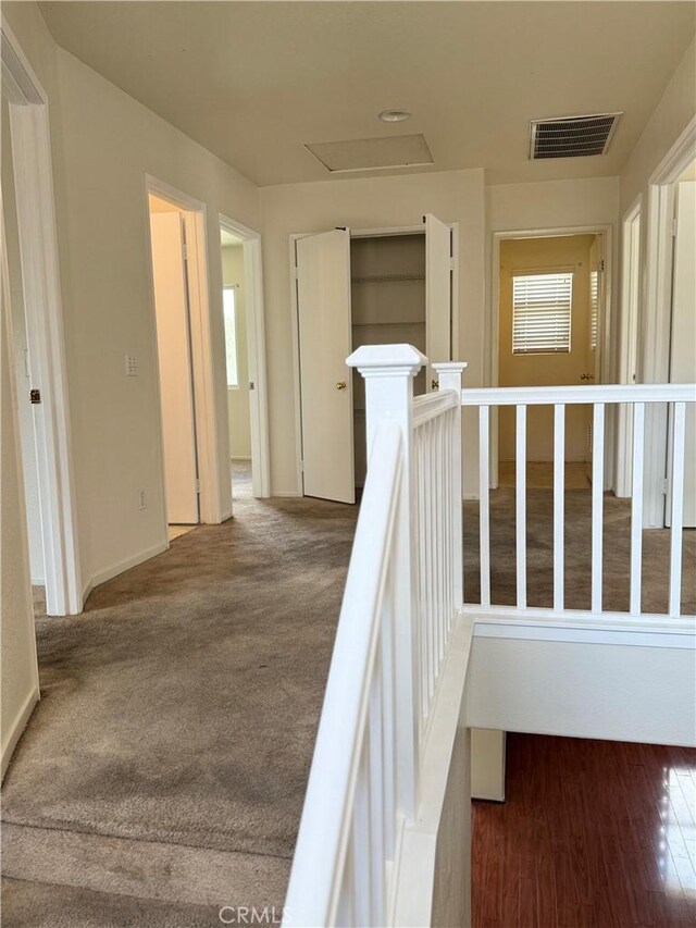 28764 Avalon Ave, Moreno Valley, CA 92555 - hall featuring an upstairs landing, plenty of natural light, baseboards, and attic access