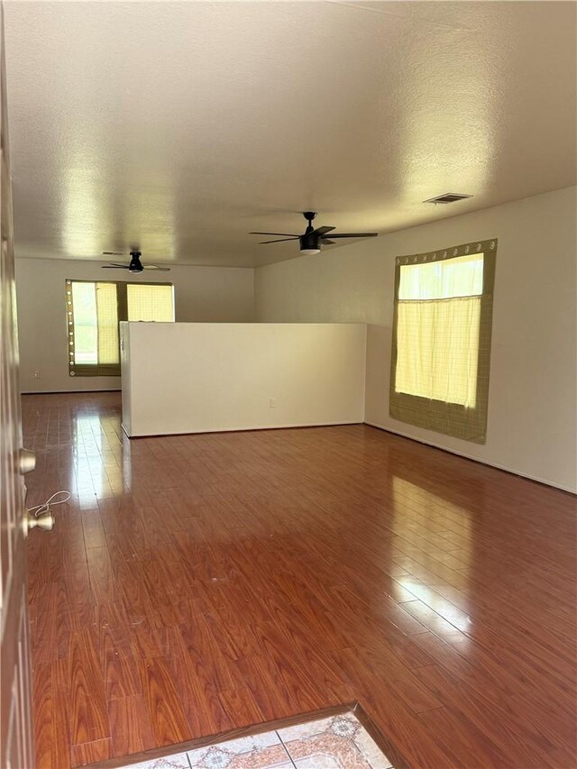 28764 Avalon Ave, Moreno Valley, CA 92555 - unfurnished room featuring ceiling fan, wood finished floors, and a textured ceiling
