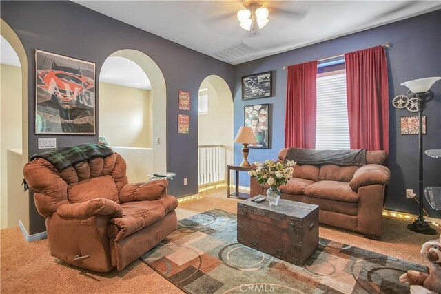 31973 Wildwood Ct, Temecula, CA 92592 - living area with arched walkways, carpet, and ceiling fan