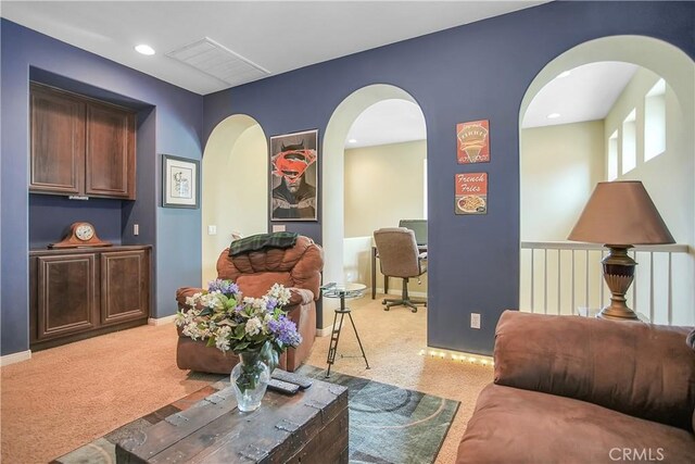 31973 Wildwood Ct, Temecula, CA 92592 - living area with light carpet, arched walkways, an office area, and recessed lighting