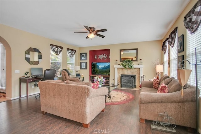 31973 Wildwood Ct, Temecula, CA 92592 - living area featuring a ceiling fan, dark wood-style floors, healthy amount of natural light, and arched walkways