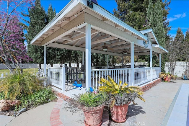 view of patio featuring a gazebo, a fenced backyard, and ceiling fan