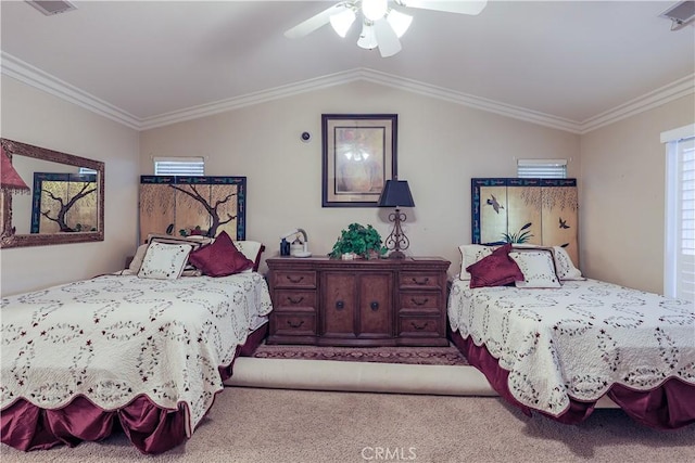 carpeted bedroom featuring visible vents, ornamental molding, a ceiling fan, and vaulted ceiling