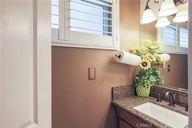 bathroom featuring plenty of natural light and vanity