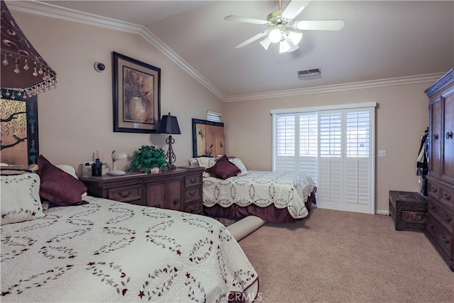 carpeted bedroom featuring visible vents, lofted ceiling, and crown molding