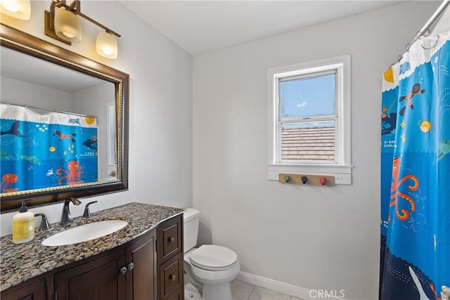 full bathroom with tile patterned flooring, curtained shower, vanity, baseboards, and toilet