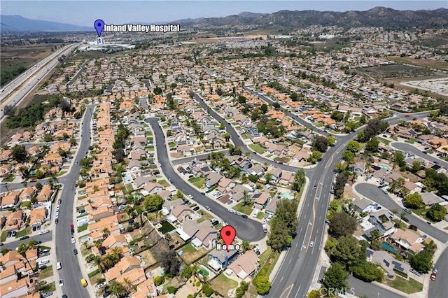 drone / aerial view featuring a mountain view and a residential view