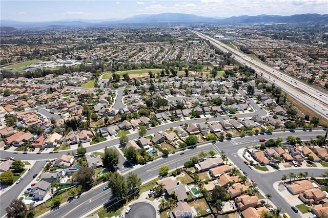aerial view featuring a mountain view and a residential view
