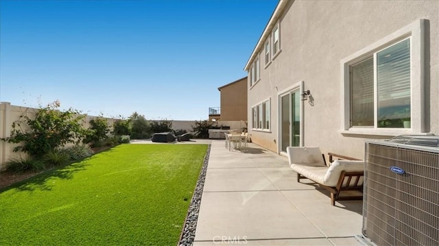 view of yard with cooling unit, a patio, and outdoor lounge area
