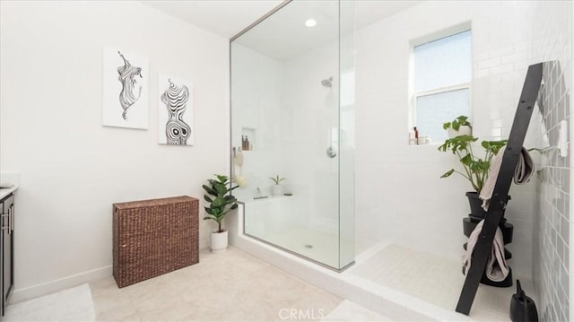 full bathroom with a shower with door and vanity