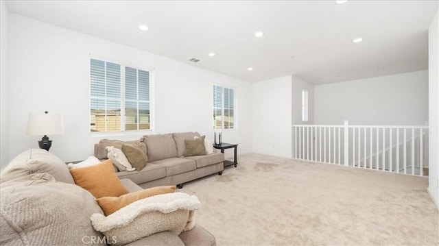 carpeted living area with recessed lighting