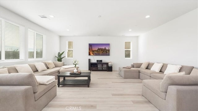 living room featuring recessed lighting and light wood-style floors