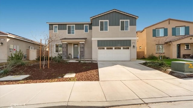 view of front of home with concrete driveway, a garage, board and batten siding, and stucco siding