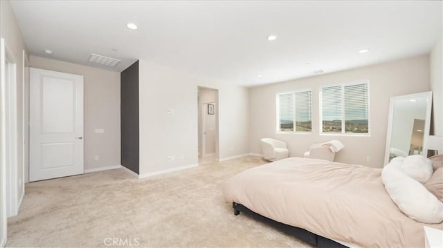 bedroom with light colored carpet, baseboards, and recessed lighting