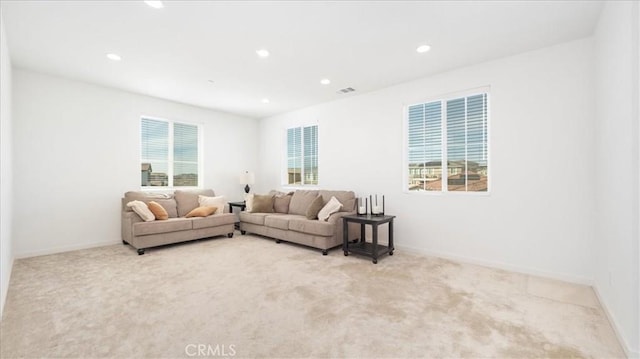 living area featuring carpet flooring, recessed lighting, and baseboards