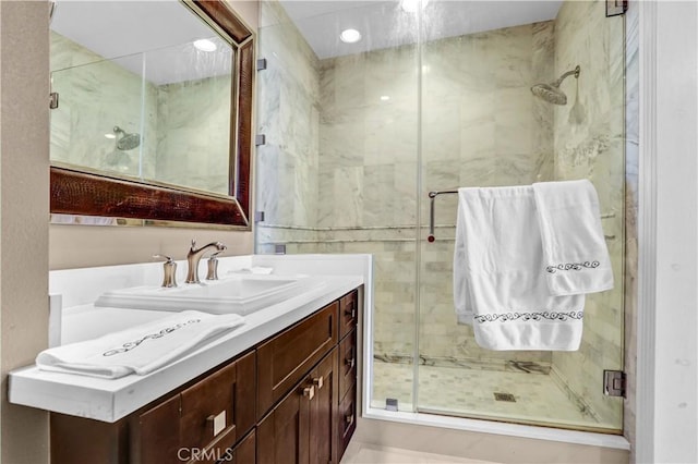 bathroom featuring vanity and a shower stall