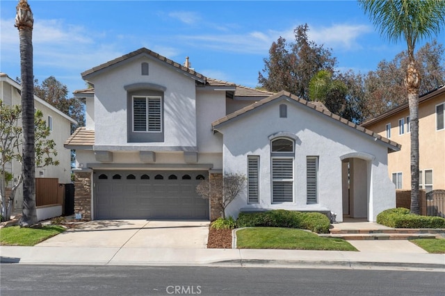 11 Spring View Way, Rancho Santa Margarita, CA 92688 - mediterranean / spanish-style house featuring stucco siding, concrete driveway, a garage, and a tiled roof