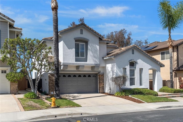 11 Spring View Way, Rancho Santa Margarita, CA 92688 - view of front of house featuring stucco siding, an attached garage, concrete driveway, stone siding, and a tiled roof