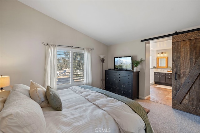 11 Spring View Way, Rancho Santa Margarita, CA 92688 - bedroom with light colored carpet, lofted ceiling, a barn door, and ensuite bath