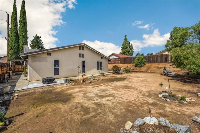 view of yard with a patio area and a fenced backyard