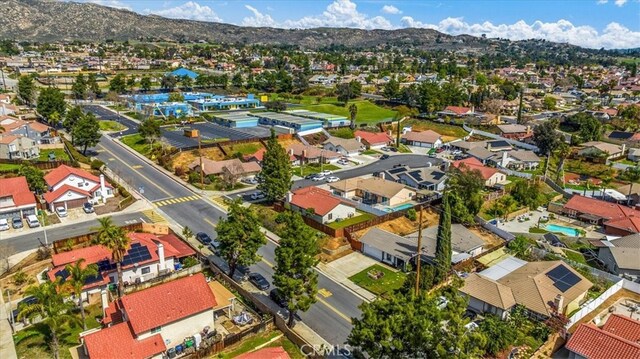 birds eye view of property featuring a residential view and a mountain view