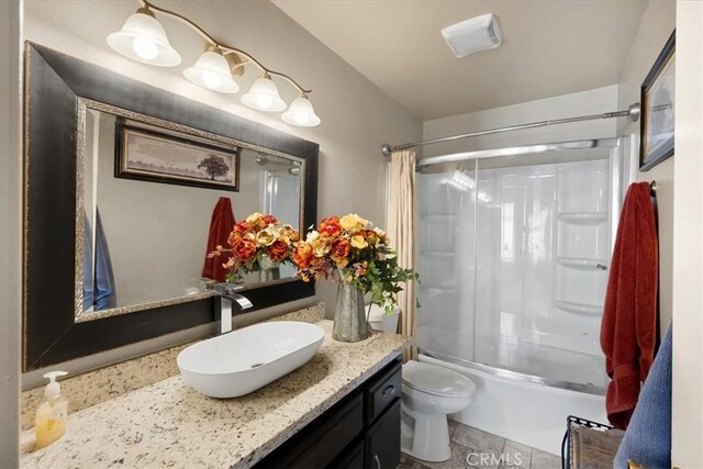 bathroom with vanity, shower / bathing tub combination, toilet, and visible vents