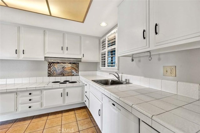 kitchen featuring tile counters, white appliances, white cabinetry, and a sink