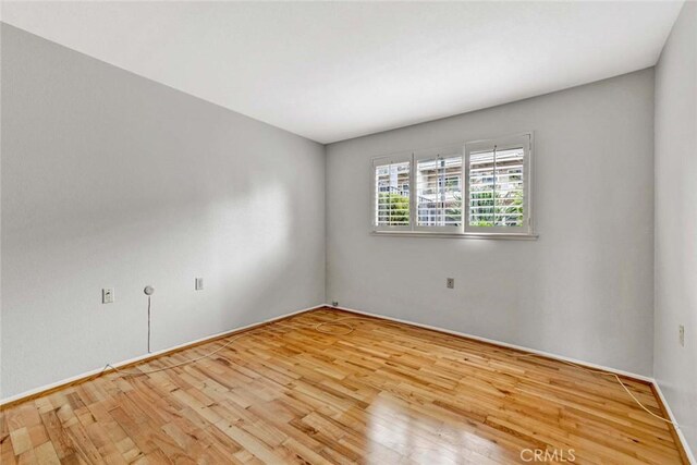 empty room featuring wood finished floors