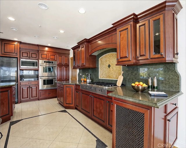 kitchen featuring light tile patterned floors, premium range hood, recessed lighting, appliances with stainless steel finishes, and tasteful backsplash