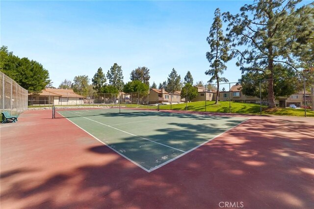 9341 E Shadowood Dr Unit E, Montclair, CA 91763 - view of tennis court with a residential view