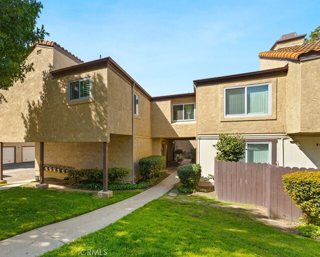 9341 E Shadowood Dr Unit E, Montclair, CA 91763 - view of front of house featuring stucco siding