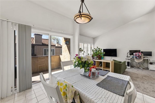9341 E Shadowood Dr Unit E, Montclair, CA 91763 - dining room with lofted ceiling, light tile patterned floors, and light colored carpet