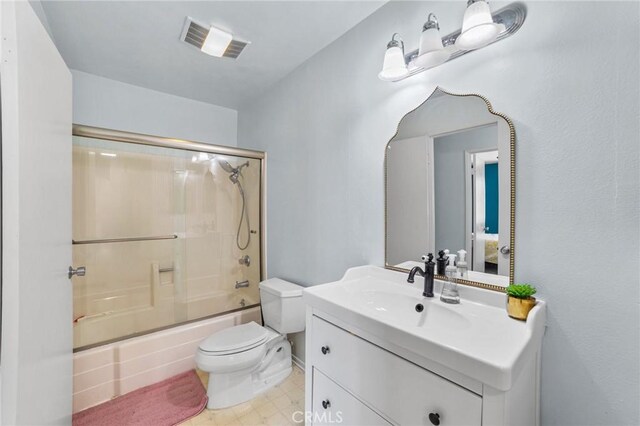 9341 E Shadowood Dr Unit E, Montclair, CA 91763 - bathroom with toilet, vanity, and shower / bath combination with glass door