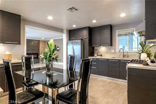 2634 Blandford Dr, Rowland Heights, CA 91748 - kitchen with visible vents, freestanding refrigerator, a sink, light countertops, and modern cabinets