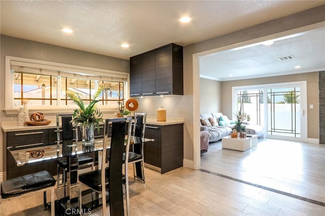 2634 Blandford Dr, Rowland Heights, CA 91748 - dining space featuring visible vents, ornamental molding, recessed lighting, light wood-style floors, and baseboards