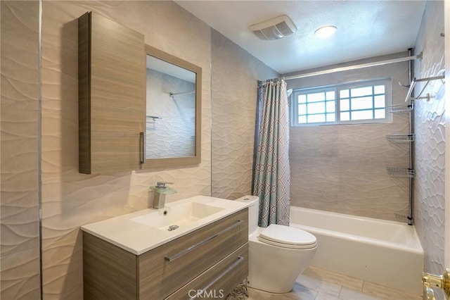 2634 Blandford Dr, Rowland Heights, CA 91748 - full bathroom featuring tasteful backsplash, toilet, vanity, tile walls, and shower / bathtub combination with curtain