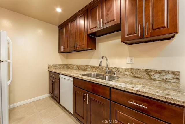 1271 E 7th St, Long Beach, CA 90813 - kitchen with baseboards, white appliances, light stone counters, and a sink