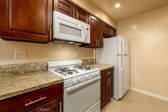 1271 E 7th St, Long Beach, CA 90813 - kitchen featuring white appliances, baseboards, and light tile patterned floors