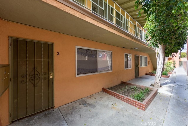 1271 E 7th St, Long Beach, CA 90813 - entrance to property featuring a patio and stucco siding