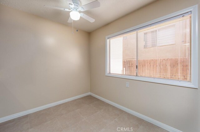 1271 E 7th St, Long Beach, CA 90813 - unfurnished room featuring baseboards, light tile patterned floors, and ceiling fan