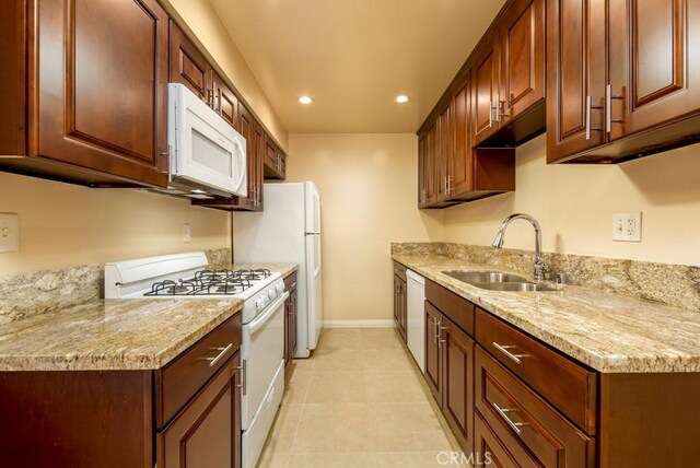 1271 E 7th St, Long Beach, CA 90813 - kitchen featuring recessed lighting, baseboards, light tile patterned floors, white appliances, and a sink