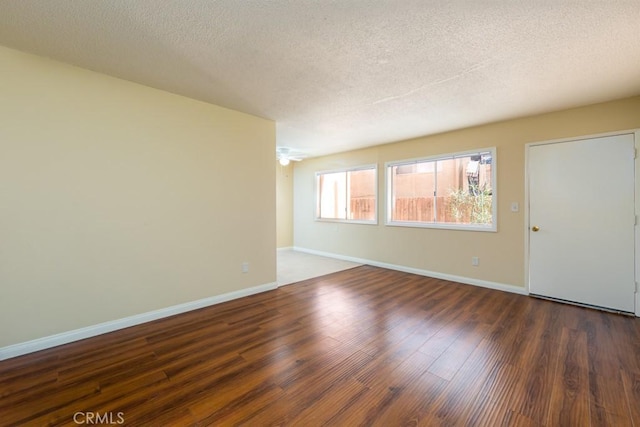 1271 E 7th St, Long Beach, CA 90813 - unfurnished room featuring a textured ceiling, baseboards, and wood finished floors