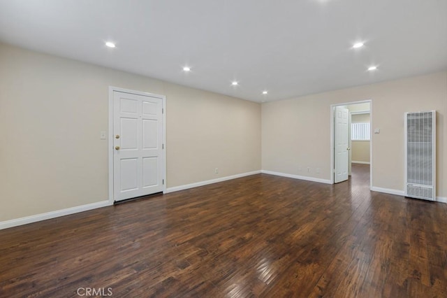 1271 E 7th St, Long Beach, CA 90813 - empty room featuring a heating unit, dark wood-style flooring, baseboards, and recessed lighting